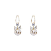 Gold Tone Bow and Pearl Earrings